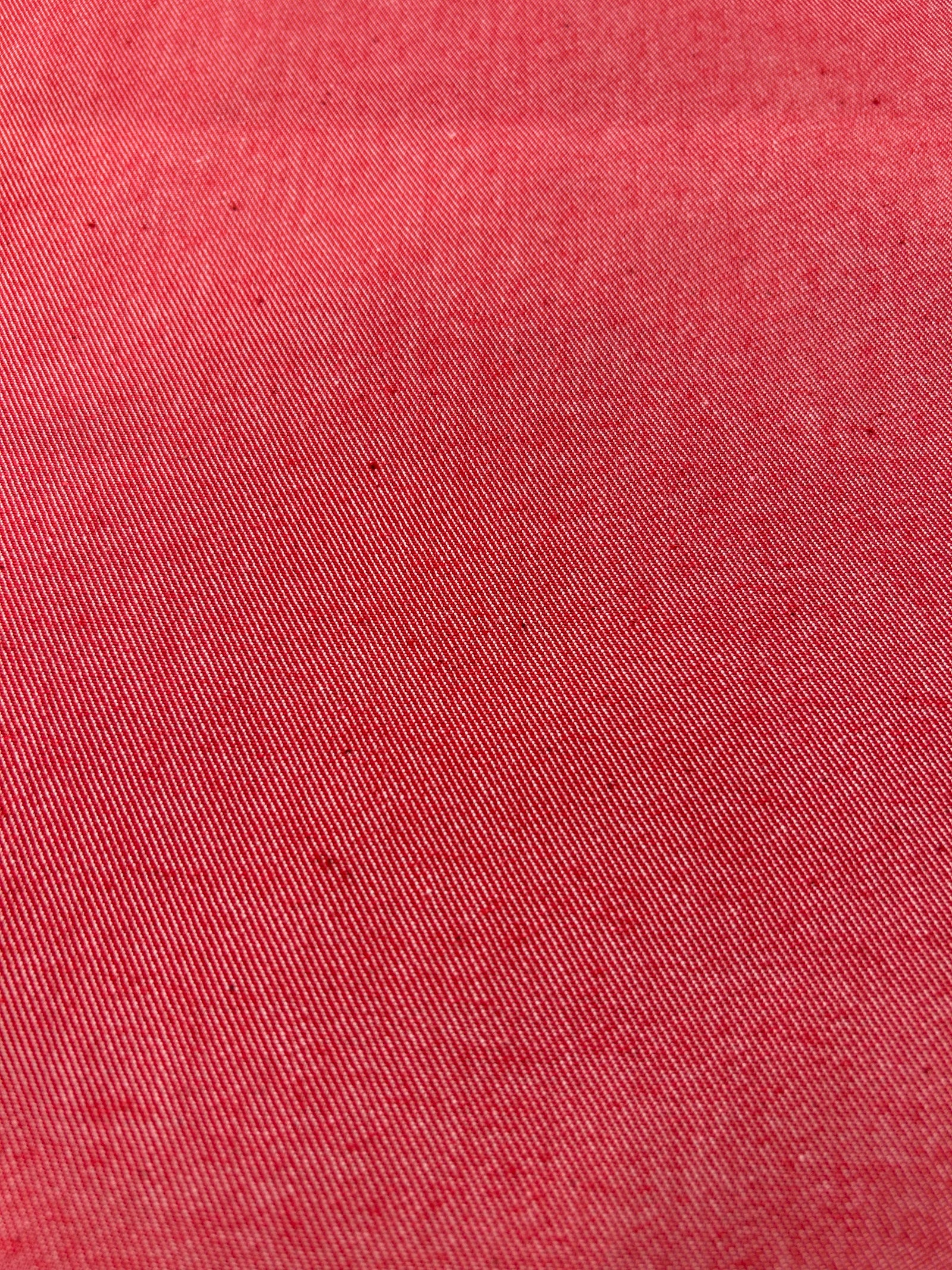 Bright red cotton denim fabric.