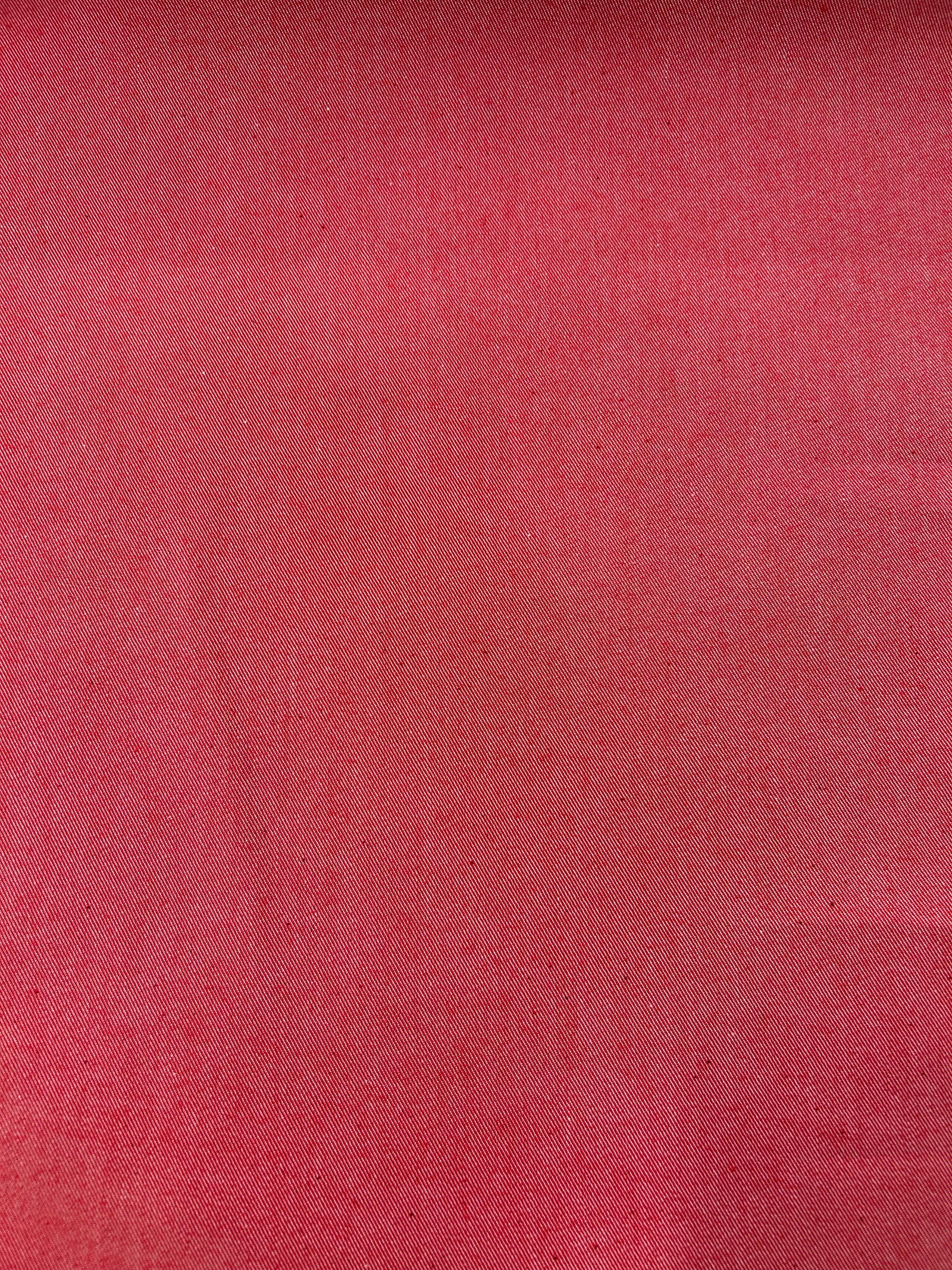 Bright red cotton denim fabric.