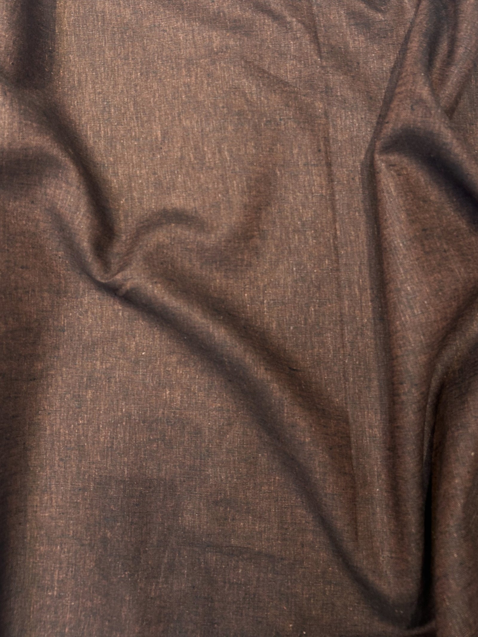 medium-weight linen is woven with deep rust brown and black threads laid flat.