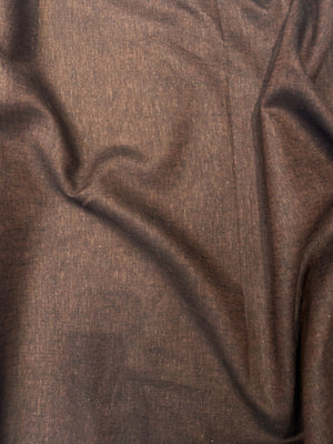 medium-weight linen is woven with deep rust brown and black thread draped.