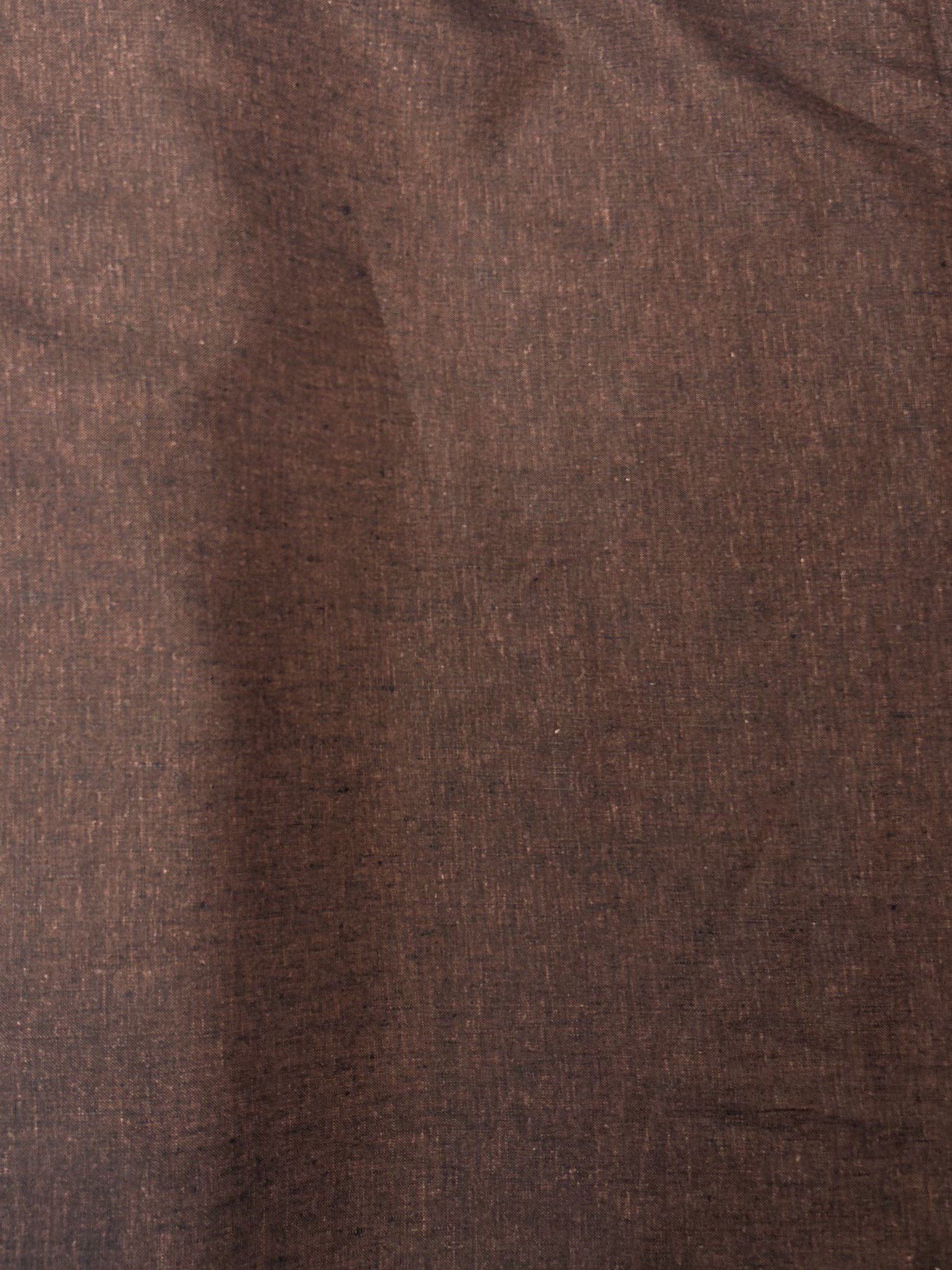 medium-weight linen is woven with deep rust brown and black threads laid flat.