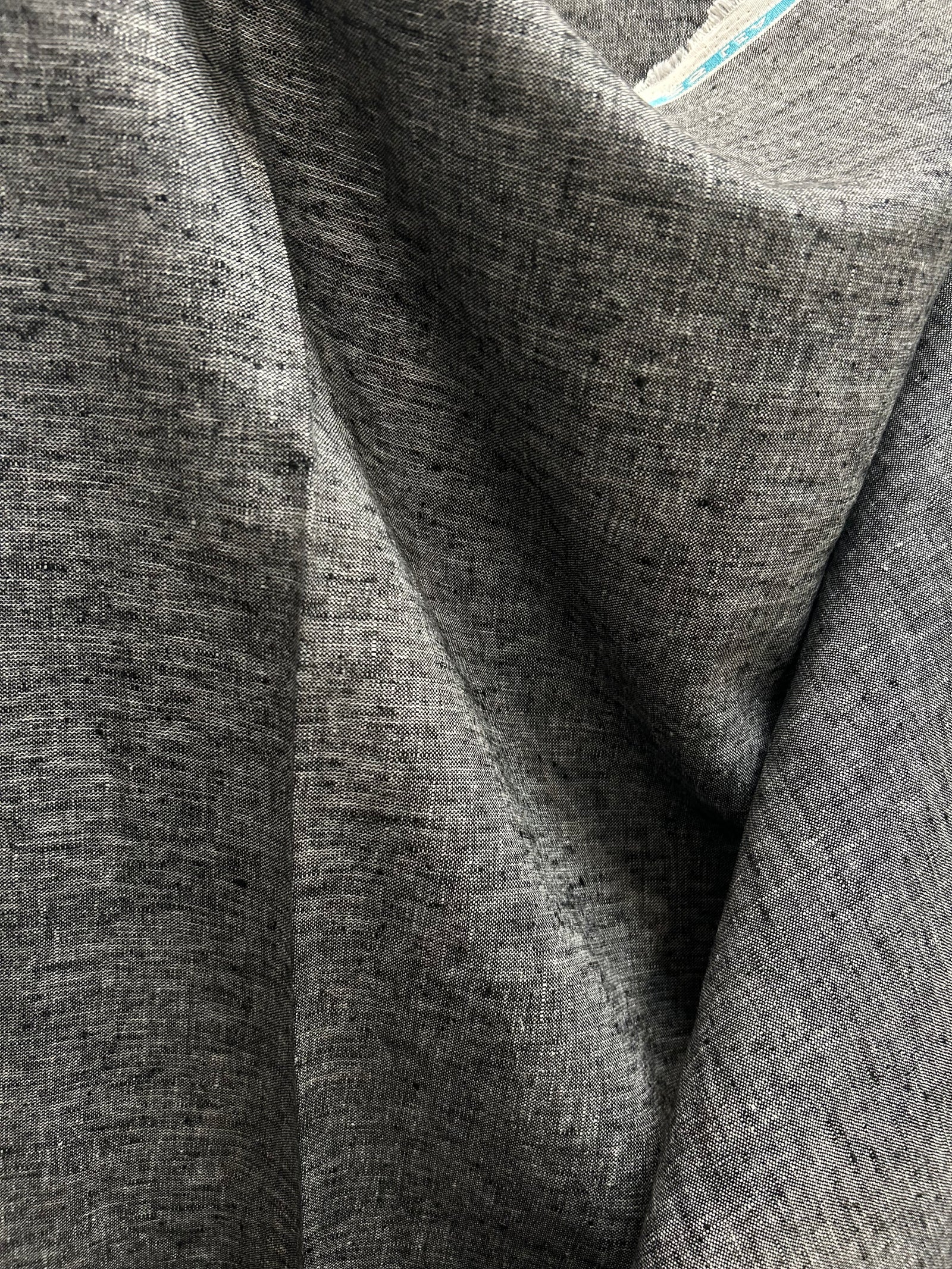 medium-weight linen is woven with black and white threads to create the salt-and-pepper look.