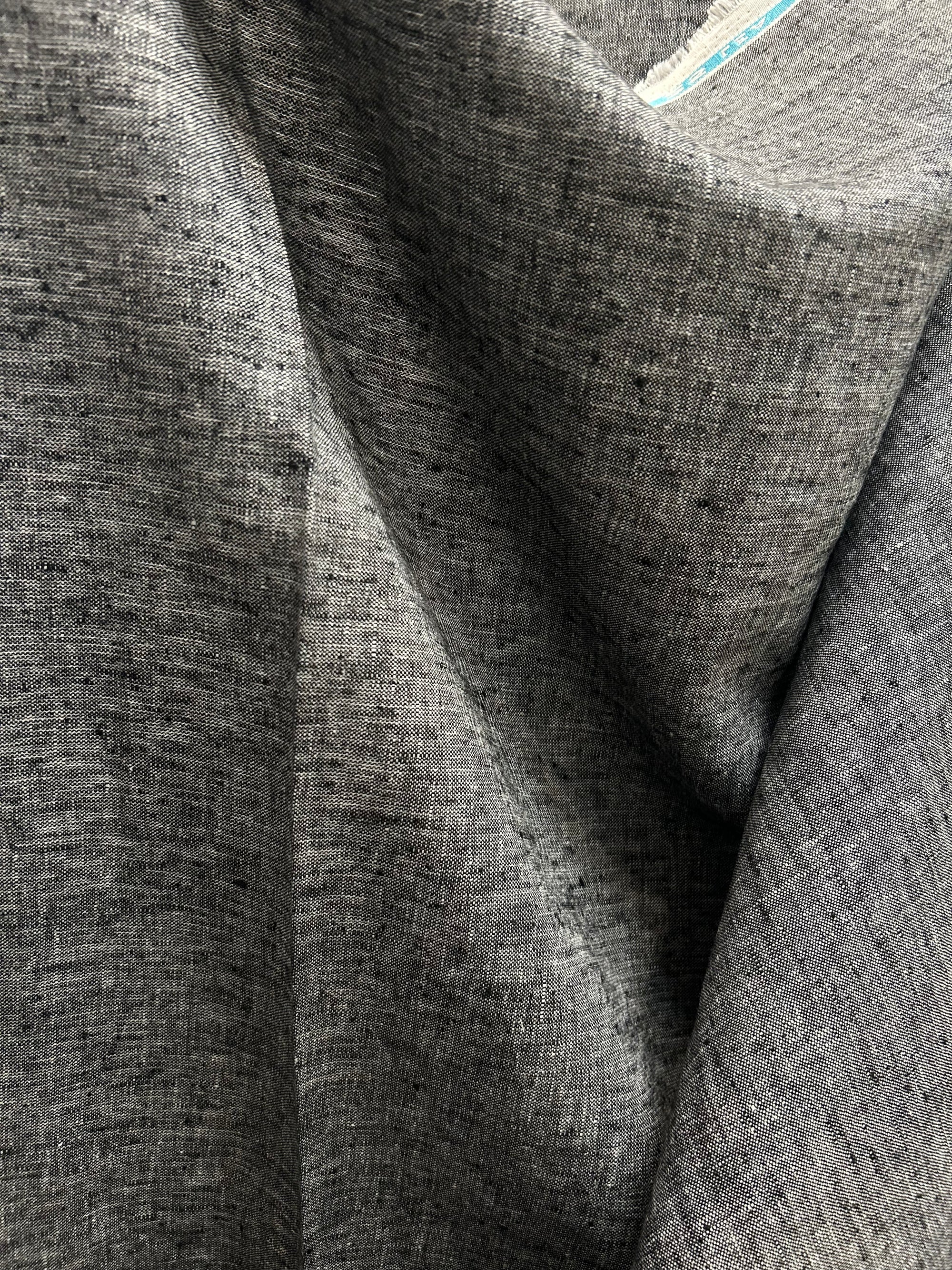 medium-weight linen is woven with black and white threads to create the salt-and-pepper look.