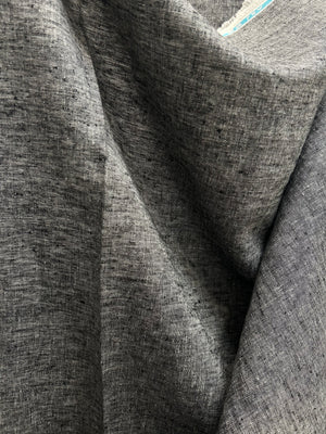 A draped medium-weight linen is woven with black and white threads.