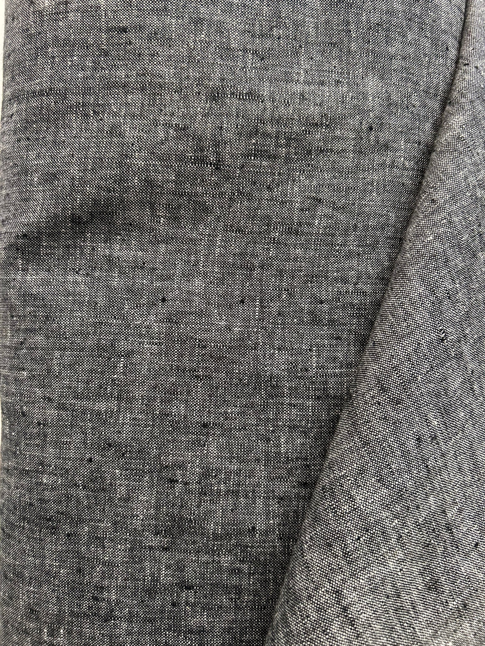 medium-weight linen is woven with black and white threads to create the salt-and-pepper look.