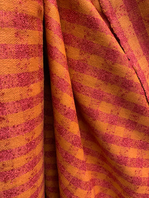 close up of raw silk in a orange and red check