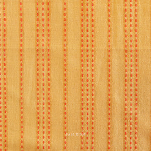 Textured fabric with orange vertical stripes on a beige background