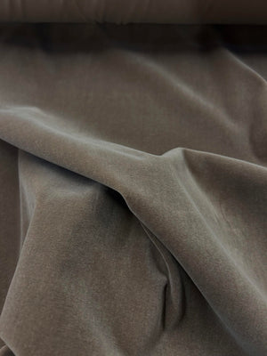 Close up of a draped mocha brown velvet.