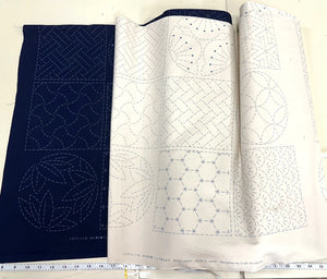 Two  pieces of sashiko fabric with different patterns on a white background.