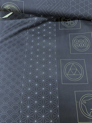 Roll of dark fabric with white sashiko patterns