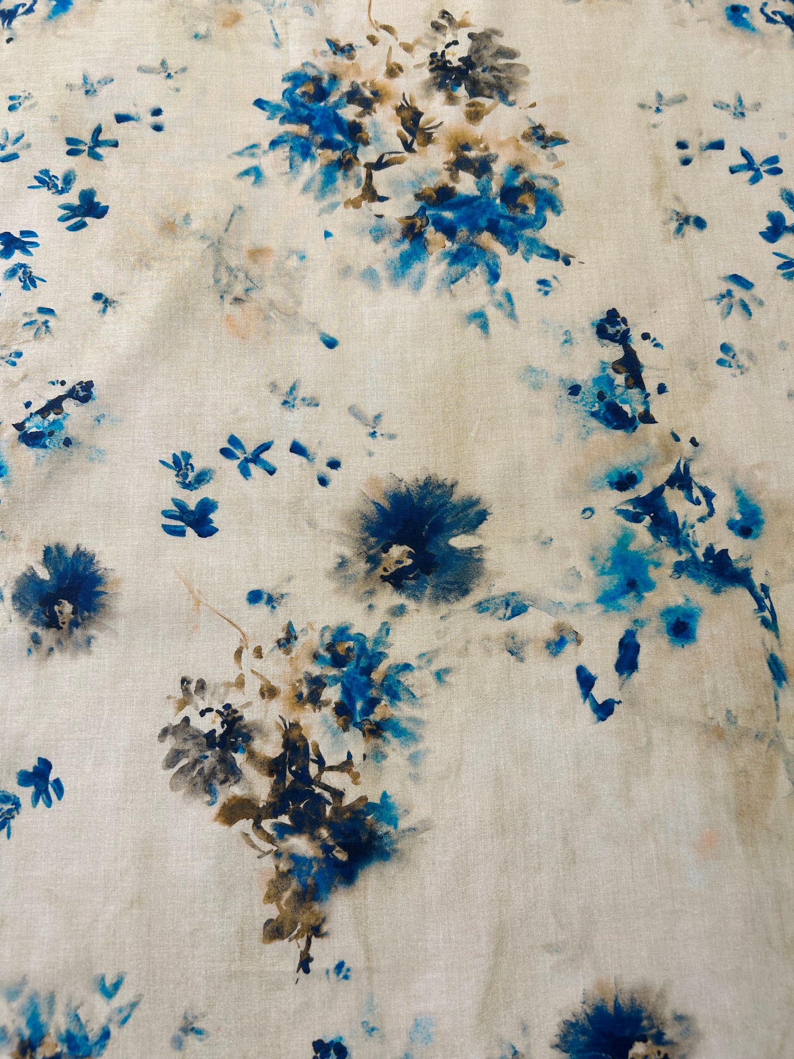 A vibrant print of splashes of blue watercolor florals.