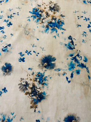 A vibrant print of splashes of blue watercolor florals.