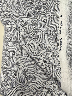 Close-up of a patterned fabric with 'Sevenberry' branding.