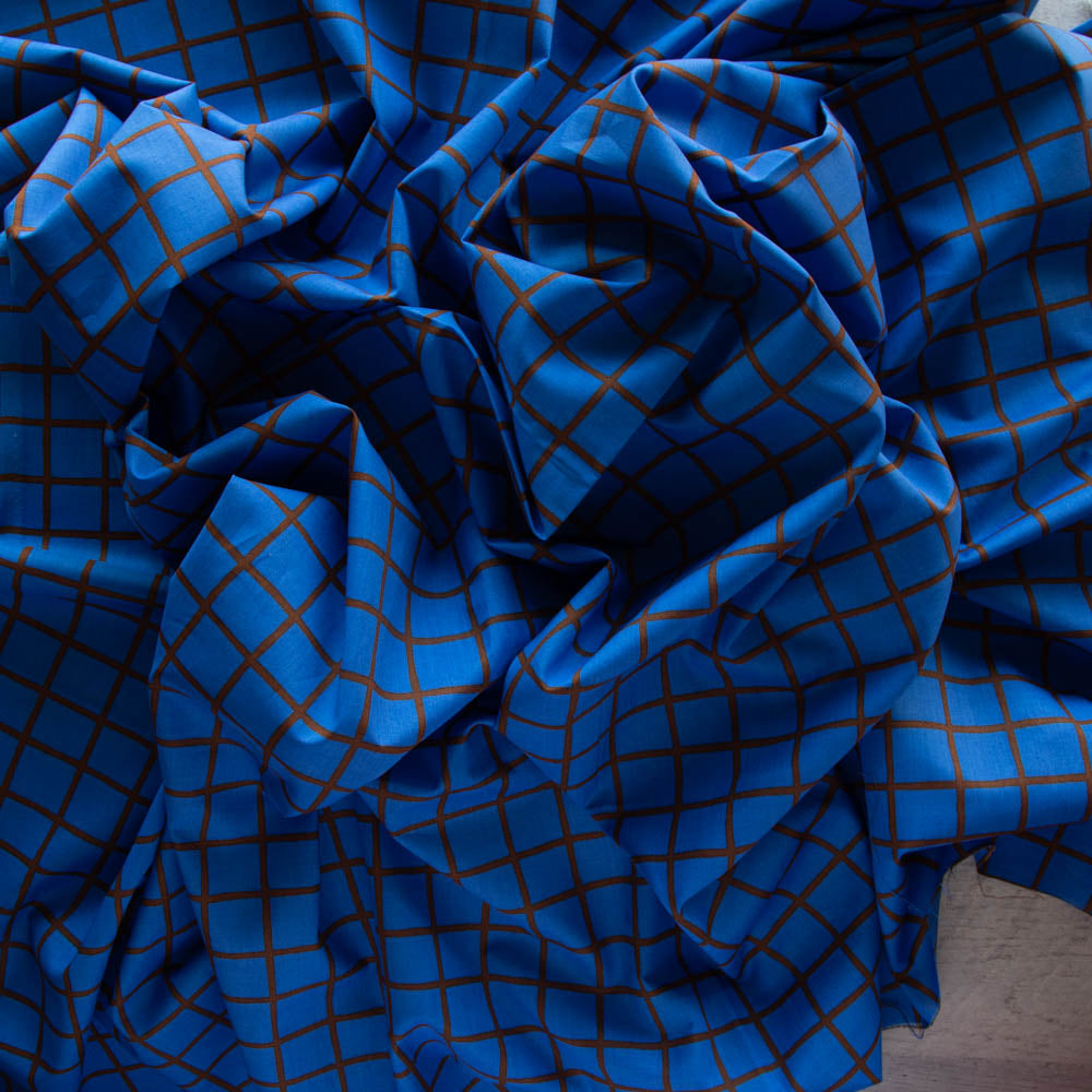 blue lawn fabric with a window pane check bunched up