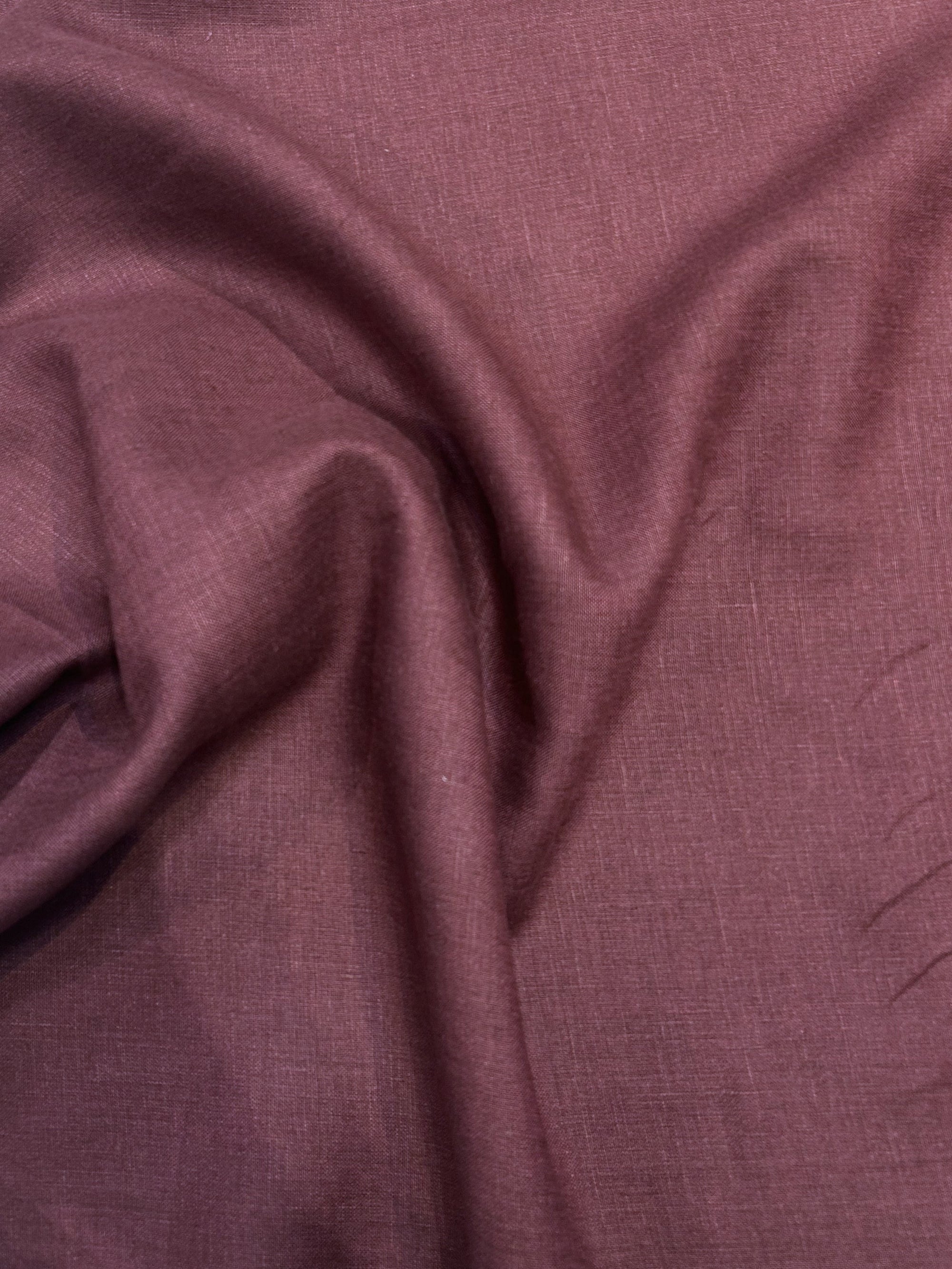 medium-weight linen in a stunning burgundy red draped.