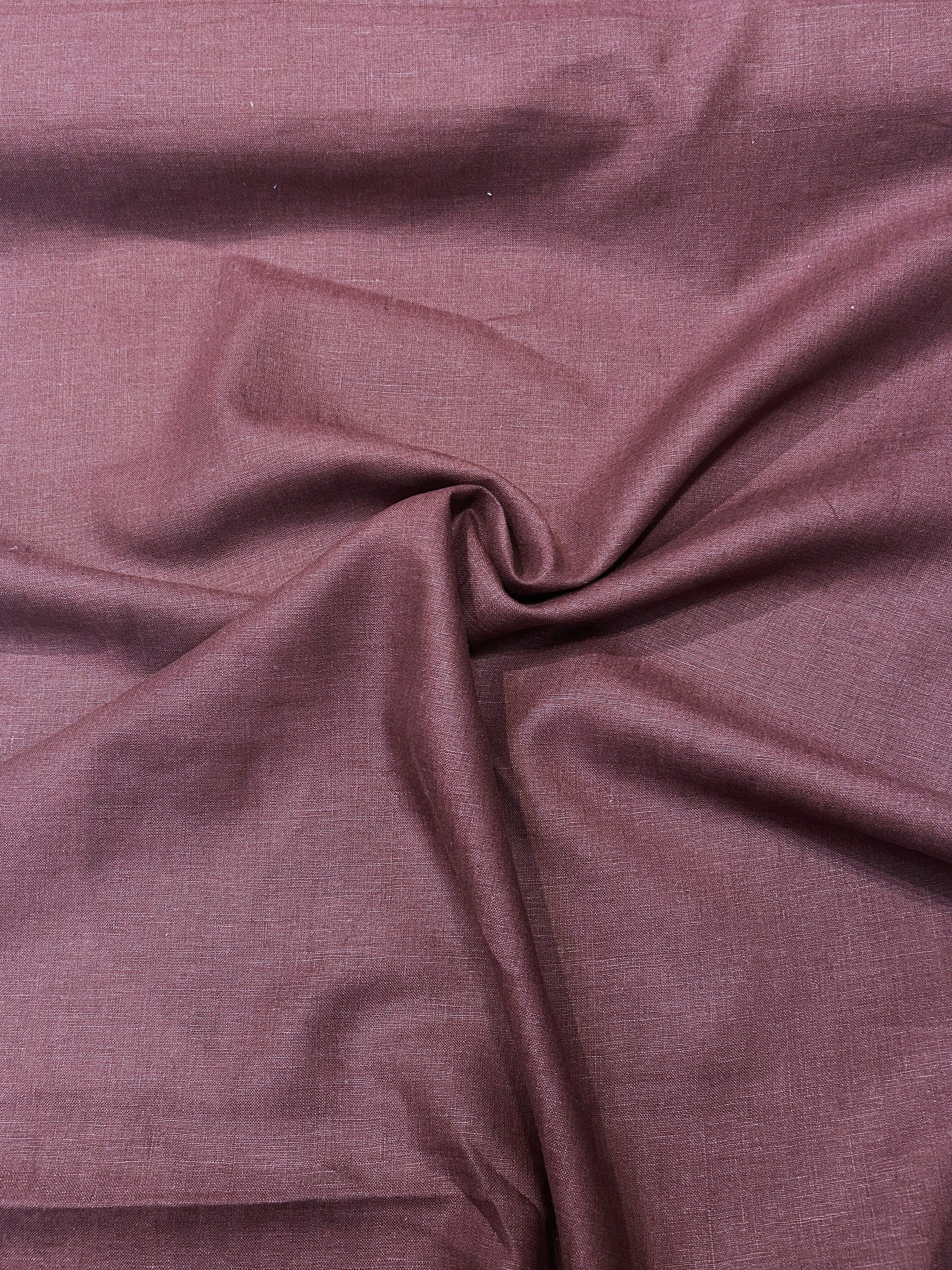 medium-weight linen in a stunning burgundy red in a swirl.