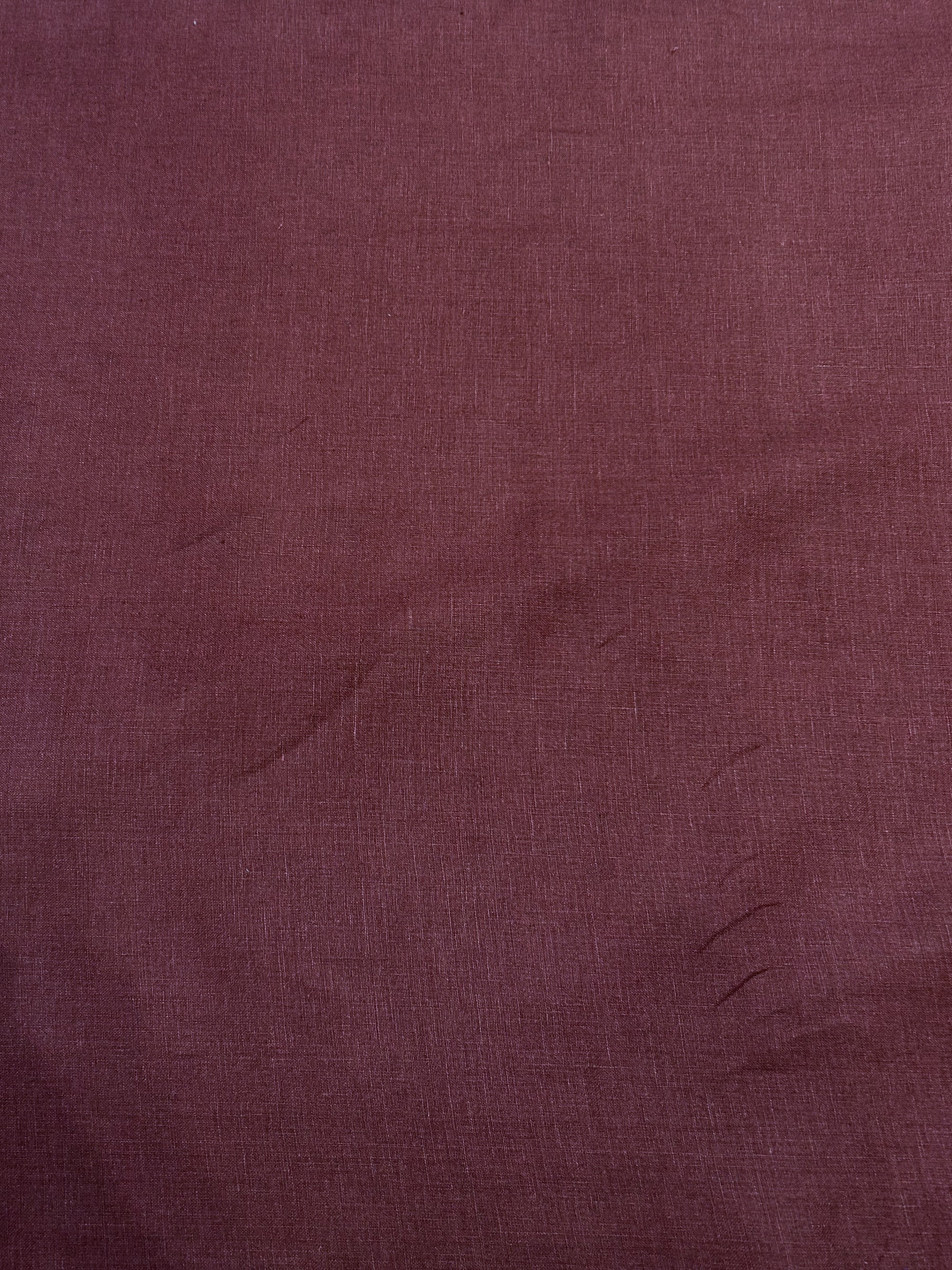 medium-weight linen in a stunning burgundy red in a swirl.