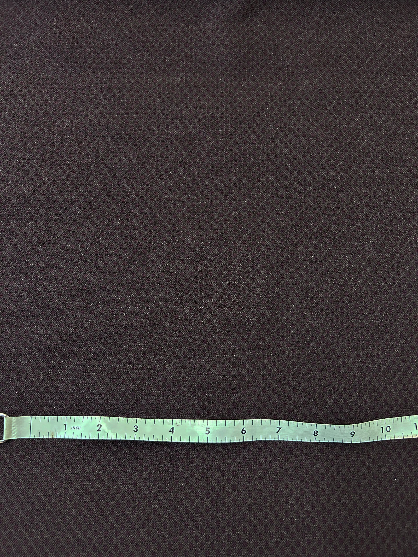 This fabric has a somewhat of a texture created by the jacquard weave. This fabric print resembles a art deco retro era. dark reds and browns.