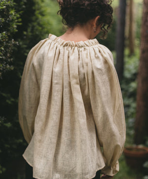 Back view of Romanian Blouse on a woman outside
