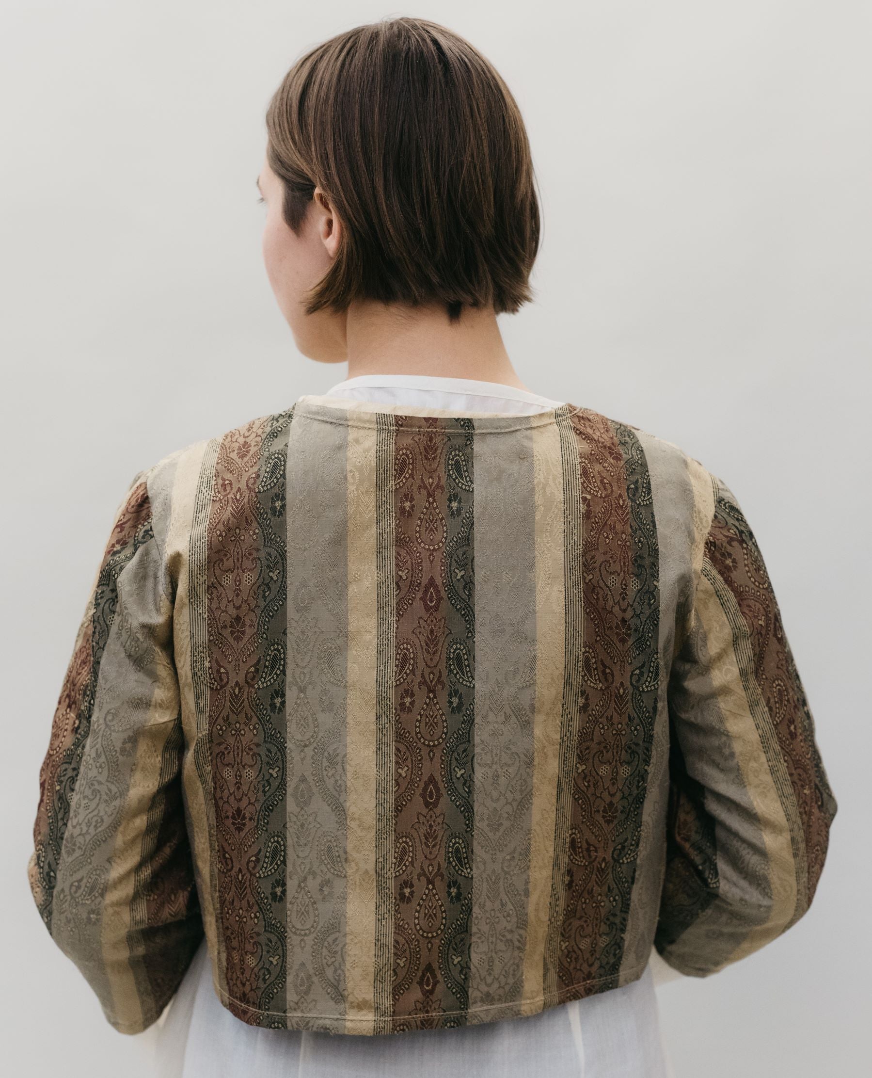 Photo of the back of the Jacket.  Jacket is shown over the Entari (tunic)