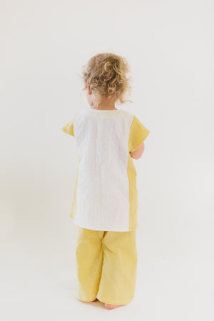 Back view of toddler wearing Turkish tunic and Turkish bloomers.