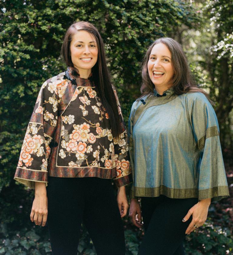 Two women standing side by side outdoors in View A.  Woman on left is in a cotton floral fabric and woman on right is wearing a light green silk jacket.