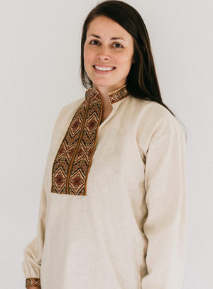 Woman wearing View B with embroidered neck opening and sleeve cuffs.  Shirt is unbuttoned to show side neck opening.