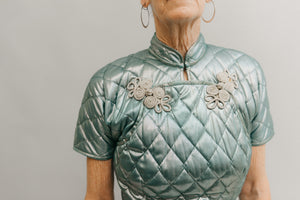 Close up view of neck line and front closure of quilted aqua 122 Hong Kong Cheongsam.