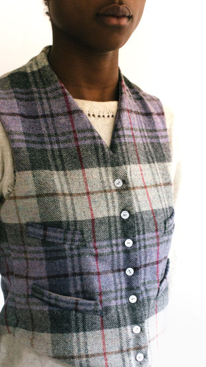 Close up of African woman wearing View C 222 Vintage Vests, collarless and four welts pockets 