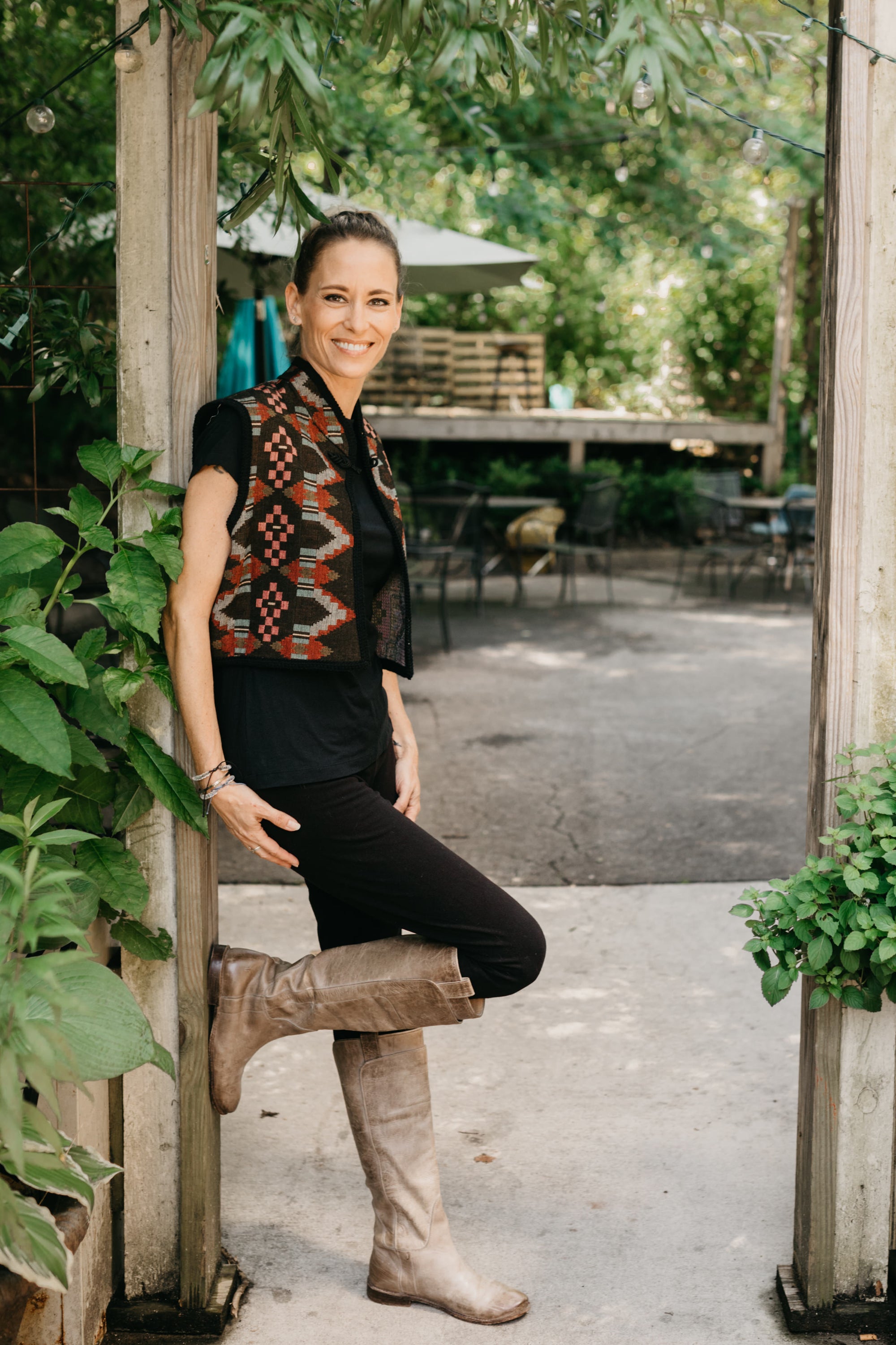 Photo of woman standing outdoors wearing Short Greek Vest.