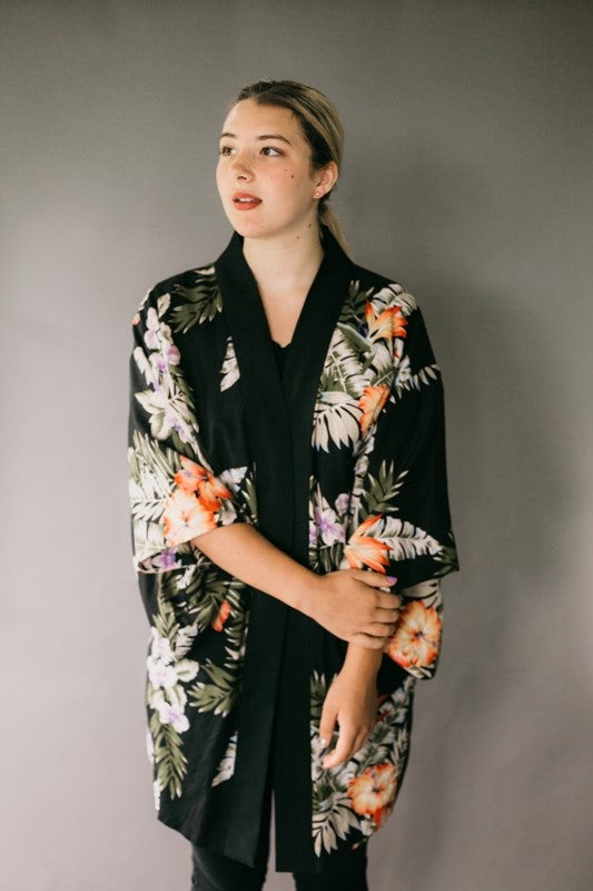 Young woman standing wearing haori jacket.  