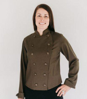 Woman wearing a brown Chef's Coat in front of white back ground.