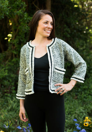 Model wearing open front adaptaion of Burmese Jacket.  Jacket has two of three pockets and no front closures.