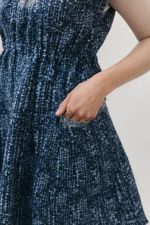 close up of hand in pocket of the women's Ghanaian Smock.