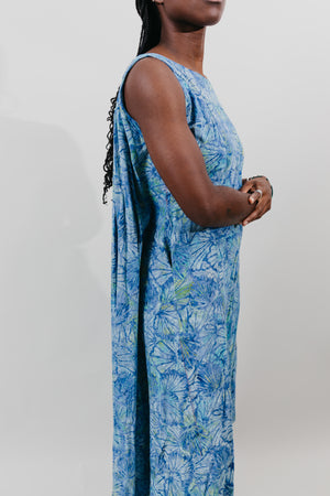 Side view of the sleeveless muumuu with the back tucked together inside.  Close up of side.