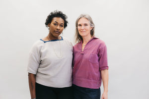 Two women , one African American wearing the square neck and a white woman wearing the v-neck 211 two Middies