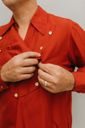 Close up of man wearing 212 Five Frontier Shirt buttoning front removable bib.