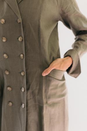 Close up of woman wearing 230 Model T Duster with hand in her pocket, and showing double button rows.