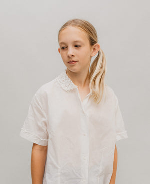 Young Blonde girl wearing The At The Hop white blouse