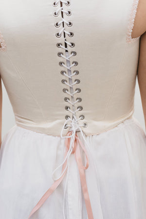 Back view of square neck Lady's Corset laced in the back in white.