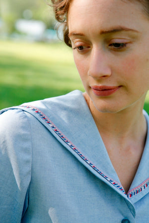 Close up of the Metro Middy Collar in blue with a red, white, and blue trim. 