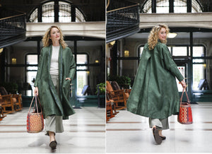 Front and back view of white blonde woman walking holding a woven bag wearing the 254 Swing Coat