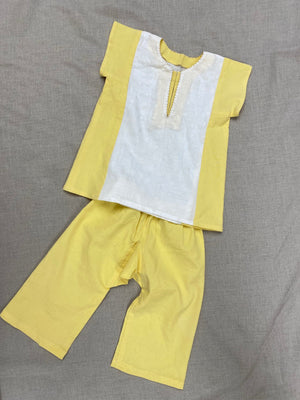 Flat lay of the yellow and white Turkish tunic and pants.